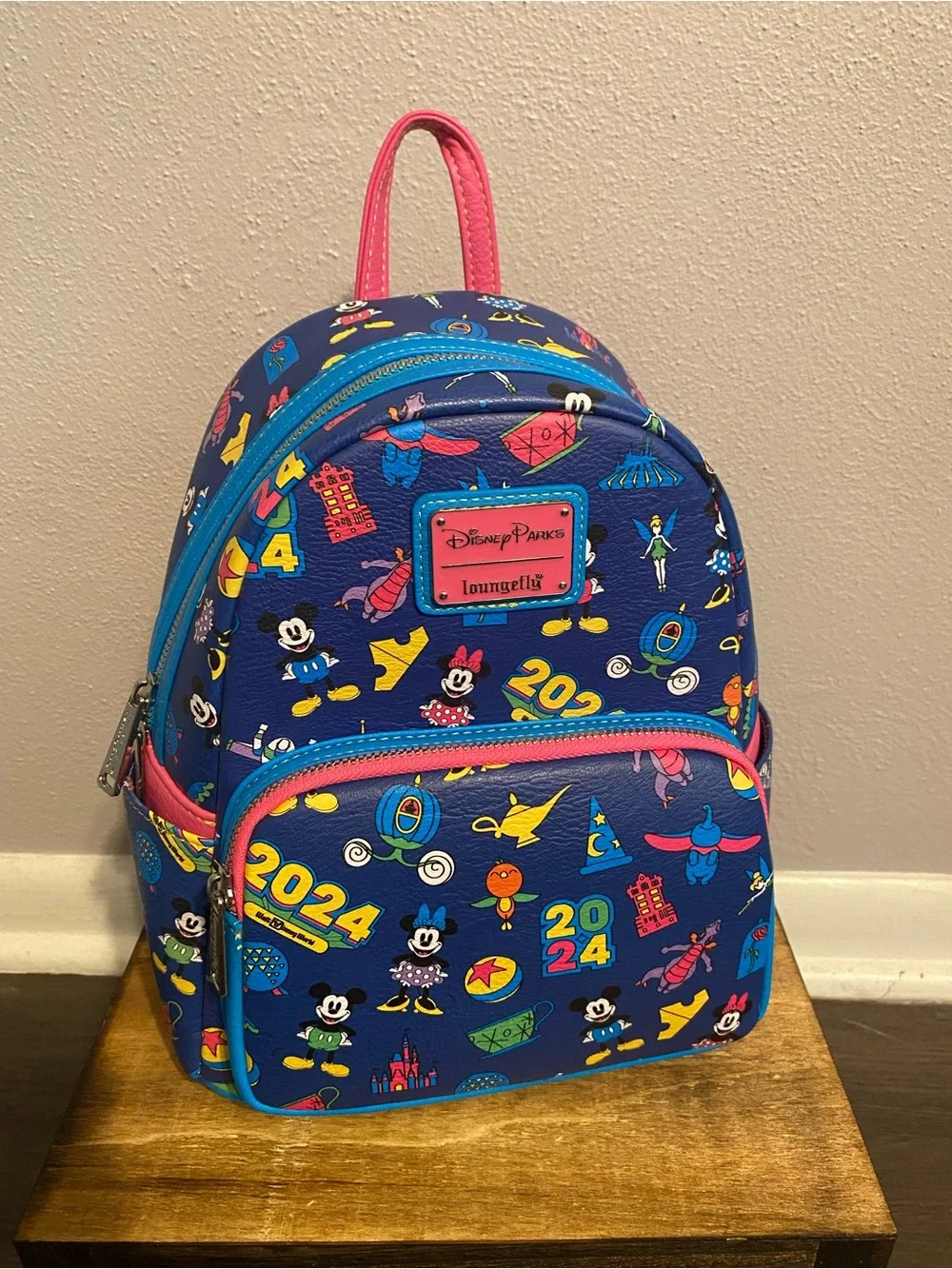 Loungefly Blue Mini Backpack with Pink Trim and Multicolor Disney Icons